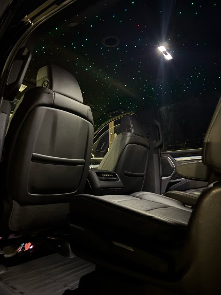 Green starlight ceiling in Pearson Limo luxury SUV Toronto
